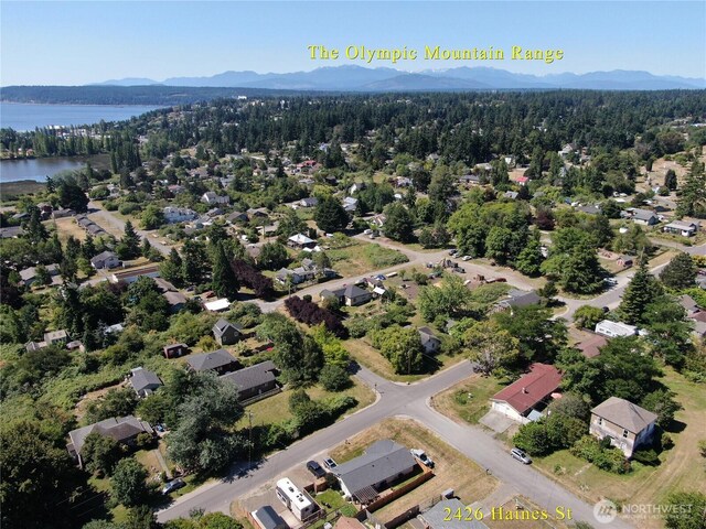 2426 Haines St, Port Townsend, WA 98368 - aerial perspective of suburban area featuring a water and mountain view and a heavily wooded area