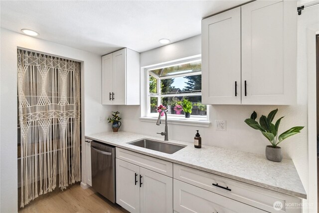 2426 Haines St, Port Townsend, WA 98368 - kitchen with dishwasher, white cabinetry, light stone counters, light wood-type flooring, and recessed lighting