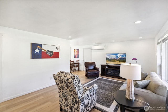 2426 Haines St, Port Townsend, WA 98368 - living room with a wall mounted AC, light wood-style flooring, and recessed lighting