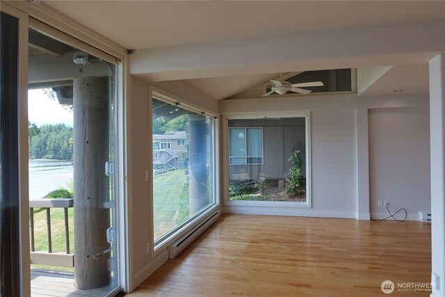 181 N Bay Ln Unit 2, Port Ludlow, WA 98165 - unfurnished sunroom with a baseboard heating unit, healthy amount of natural light, and baseboard heating