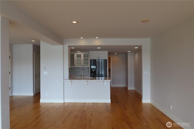 181 N Bay Ln Unit 2, Port Ludlow, WA 98165 - unfurnished living room with light wood-style flooring and recessed lighting
