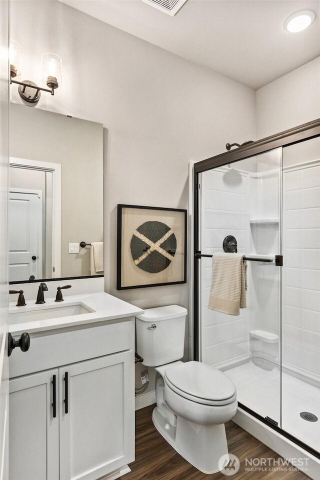 32324 135th Pl SE Unit 211, Sultan, WA 98294 - full bath with a stall shower, vanity, and wood finished floors
