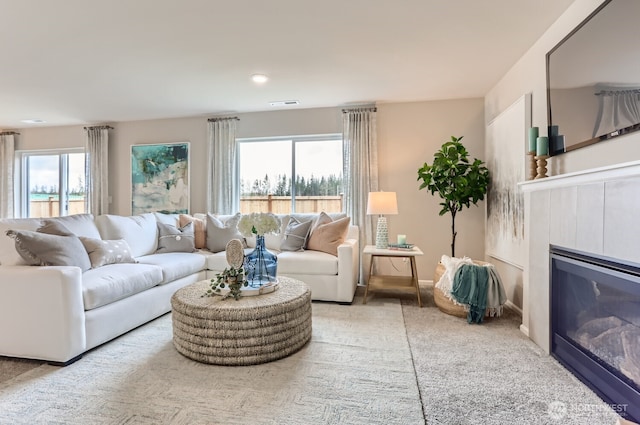 32336 135th Pl SE Unit 213, Sultan, WA 98294 - living area featuring healthy amount of natural light and a glass covered fireplace
