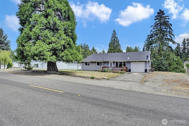 7212 188th Ave E, Bonney Lake, WA 98391 - view of front of home with an attached garage, driveway, and covered porch