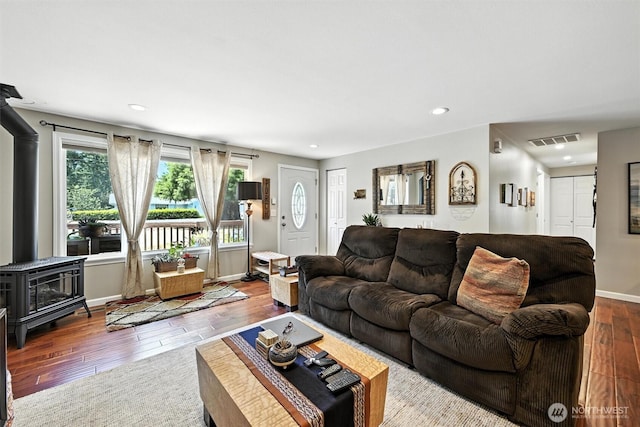 7212 188th Ave E, Bonney Lake, WA 98391 - living area featuring a wood stove, hardwood / wood-style flooring, and recessed lighting