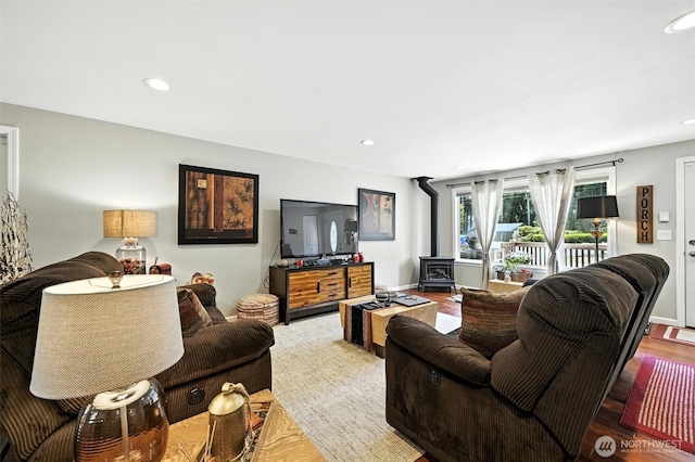 7212 188th Ave E, Bonney Lake, WA 98391 - living room with a wood stove, wood finished floors, and recessed lighting