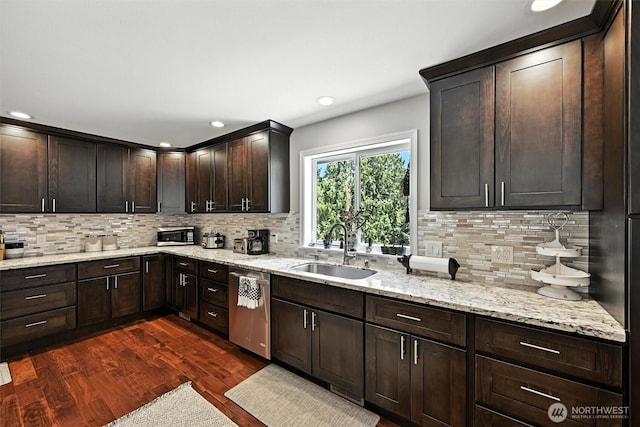 7212 188th Ave E, Bonney Lake, WA 98391 - kitchen featuring appliances with stainless steel finishes, dark wood-type flooring, decorative backsplash, dark brown cabinetry, and recessed lighting