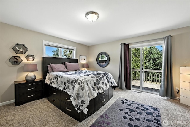 7212 188th Ave E, Bonney Lake, WA 98391 - bedroom with light colored carpet, access to outside, and multiple windows
