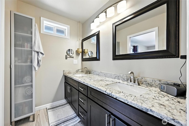 7212 188th Ave E, Bonney Lake, WA 98391 - bathroom with double vanity and wood finished floors