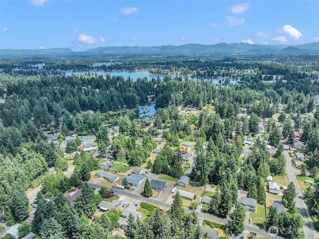 7212 188th Ave E, Bonney Lake, WA 98391 - aerial view of property's location with a heavily wooded area and a water and mountain view