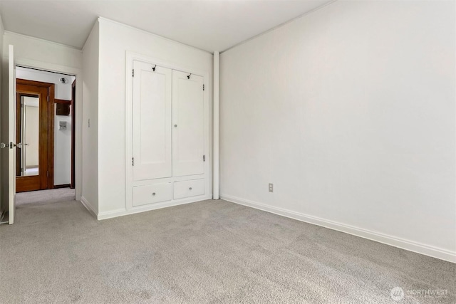 3121 Franklin Ave E Unit 24, Seattle, WA 98102 - unfurnished bedroom with light colored carpet and baseboards