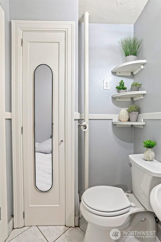 3121 Franklin Ave E Unit 24, Seattle, WA 98102 - bathroom with toilet and tile patterned floors