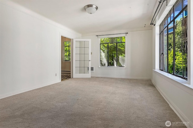 3121 Franklin Ave E Unit 24, Seattle, WA 98102 - spare room with carpet flooring and french doors
