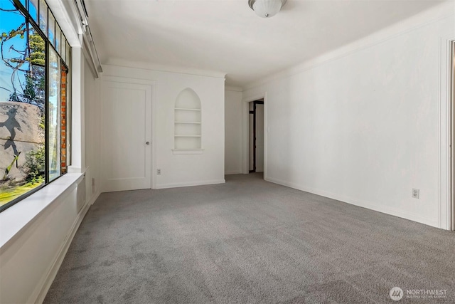 3121 Franklin Ave E Unit 24, Seattle, WA 98102 - unfurnished room with light carpet and built in features