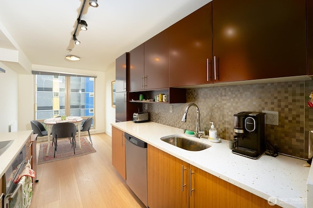 500 5th Ave W Unit 505, Seattle, WA 98119 - kitchen with appliances with stainless steel finishes, light wood-style flooring, decorative backsplash, open shelves, and light stone countertops