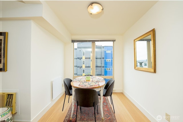 500 5th Ave W Unit 505, Seattle, WA 98119 - dining space featuring light wood-type flooring and baseboards