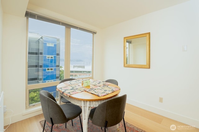 500 5th Ave W Unit 505, Seattle, WA 98119 - dining space featuring light wood finished floors and baseboards