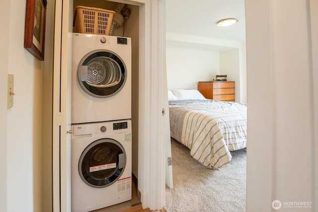 500 5th Ave W Unit 505, Seattle, WA 98119 - laundry room with stacked washer / dryer and carpet floors