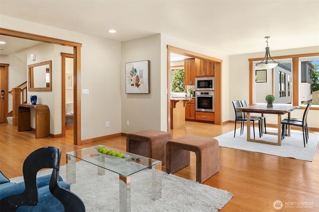 11226 NE 67th St, Kirkland, WA 98033 - dining area with light wood-style floors, healthy amount of natural light, recessed lighting, and stairs