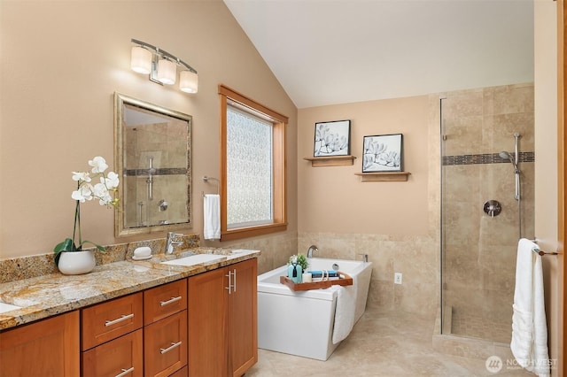 11226 NE 67th St, Kirkland, WA 98033 - full bath featuring a bathtub, vaulted ceiling, a shower stall, tile walls, and double vanity