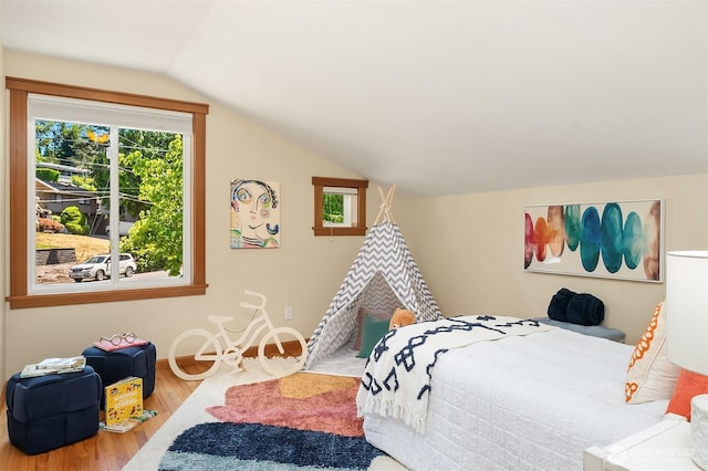 11226 NE 67th St, Kirkland, WA 98033 - bedroom with multiple windows, wood finished floors, and lofted ceiling