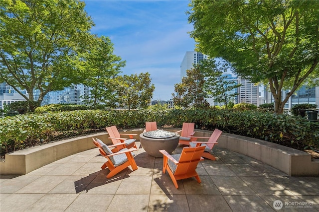 819 Virginia St Unit 2408, Seattle, WA 98101 - view of patio featuring an outdoor fire pit