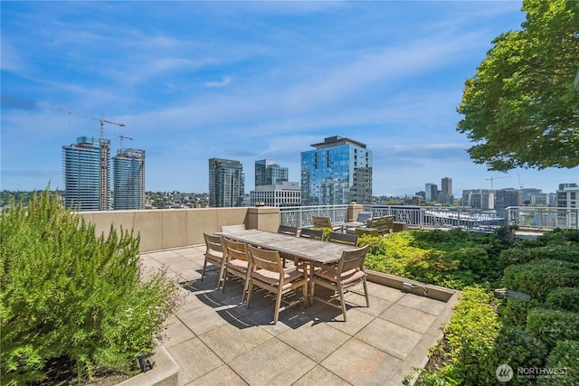 819 Virginia St Unit 2408, Seattle, WA 98101 - view of patio / terrace with a skyline view and outdoor dining area