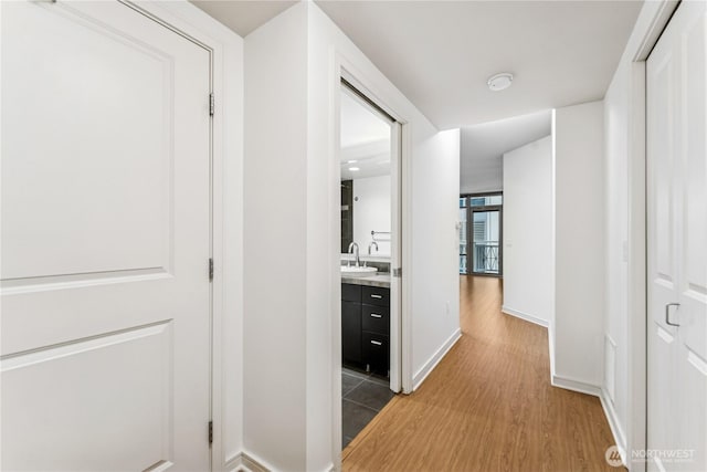 819 Virginia St Unit 2408, Seattle, WA 98101 - hallway featuring light wood-type flooring and baseboards