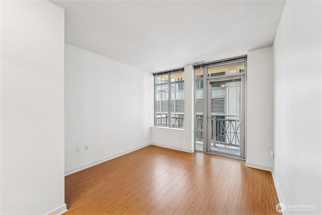 819 Virginia St Unit 2408, Seattle, WA 98101 - empty room with wood finished floors and baseboards