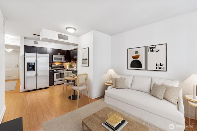 819 Virginia St Unit 2408, Seattle, WA 98101 - living area featuring light wood finished floors