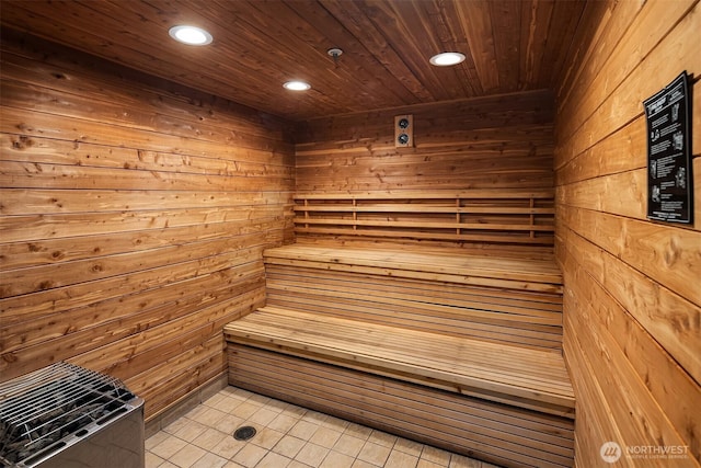 819 Virginia St Unit 2408, Seattle, WA 98101 - sauna with recessed lighting, wooden walls, tile patterned flooring, and wooden ceiling