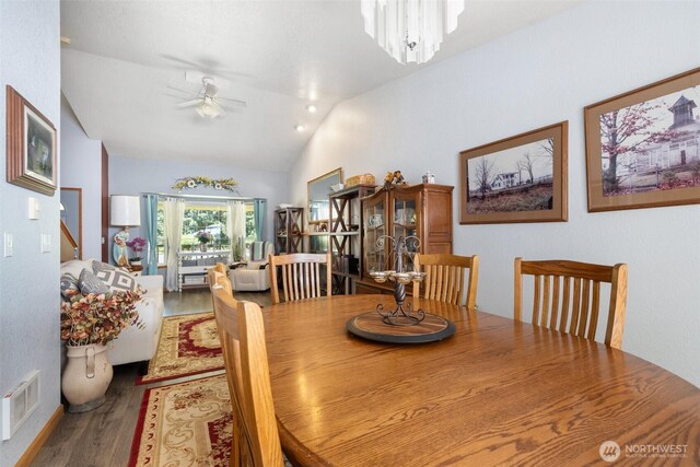103 Nikula Rd W, Winlock, WA 98596 - dining area with lofted ceiling, wood finished floors, ceiling fan, and stairs