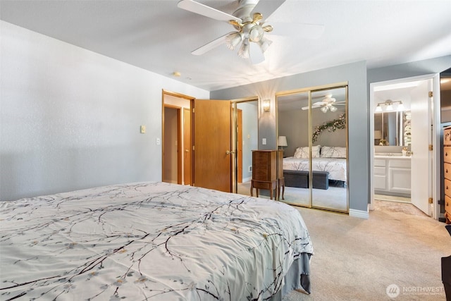103 Nikula Rd W, Winlock, WA 98596 - bedroom with carpet floors, multiple closets, ensuite bathroom, and a ceiling fan