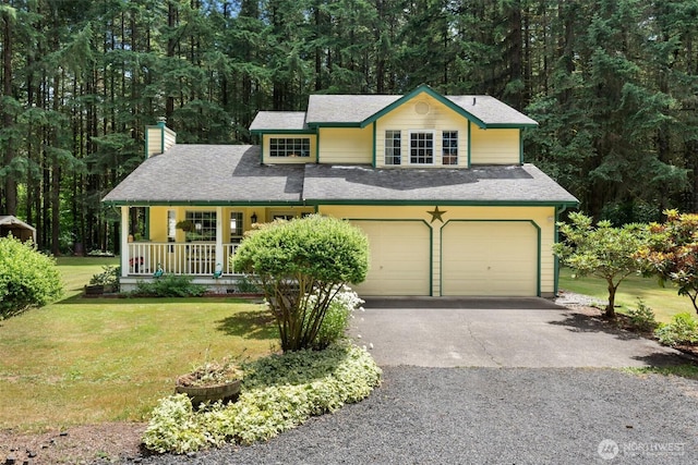 103 Nikula Rd W, Winlock, WA 98596 - view of front of property featuring a chimney, a porch, a front yard, asphalt driveway, and a wooded view
