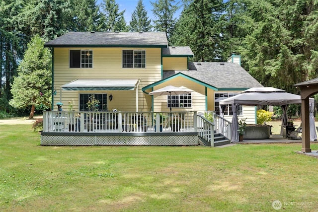 103 Nikula Rd W, Winlock, WA 98596 - back of property featuring a gazebo, a wooden deck, a yard, a carport, and a chimney