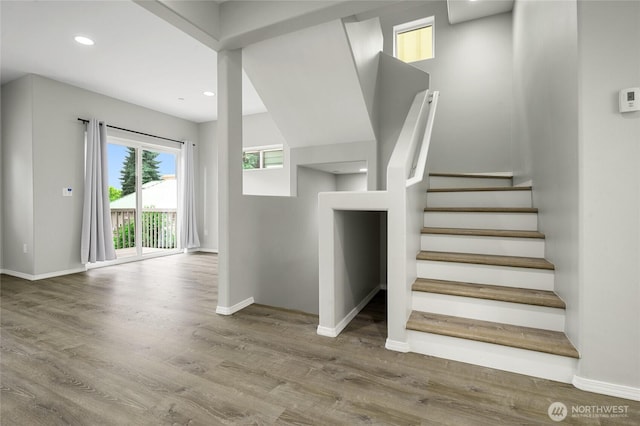 8077 165th Ln NE, Redmond, WA 98052 - stairs featuring wood finished floors and recessed lighting