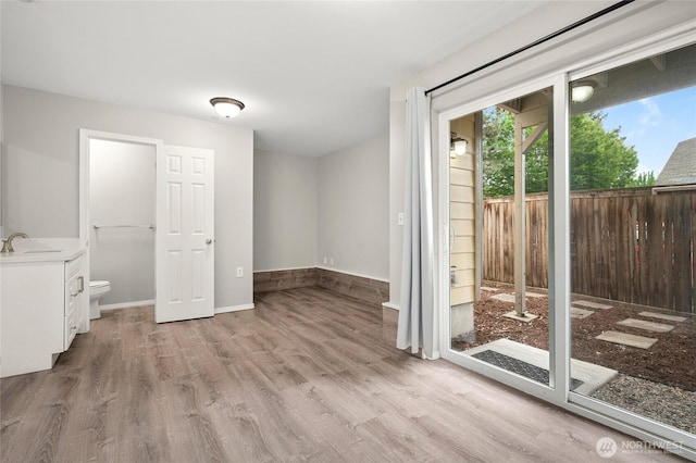 8077 165th Ln NE, Redmond, WA 98052 - empty room with light wood-style flooring and baseboards