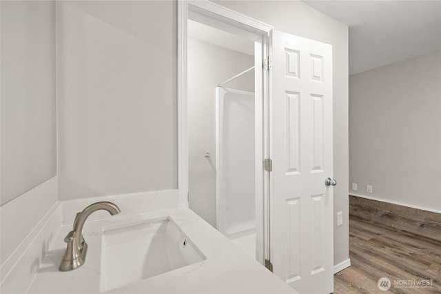 8077 165th Ln NE, Redmond, WA 98052 - bathroom with a sink and wood finished floors