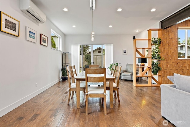4113 Palatine Ave N, Seattle, WA 98103 - dining space with a wall mounted AC, healthy amount of natural light, wood finished floors, and recessed lighting