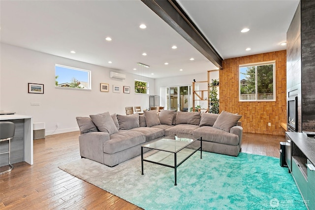 4113 Palatine Ave N, Seattle, WA 98103 - living room with a wall mounted air conditioner, light wood-style flooring, recessed lighting, and plenty of natural light