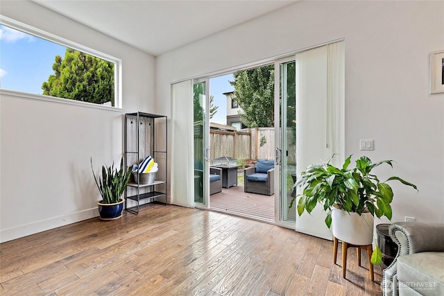 4113 Palatine Ave N, Seattle, WA 98103 - doorway to outside featuring wood-type flooring and baseboards