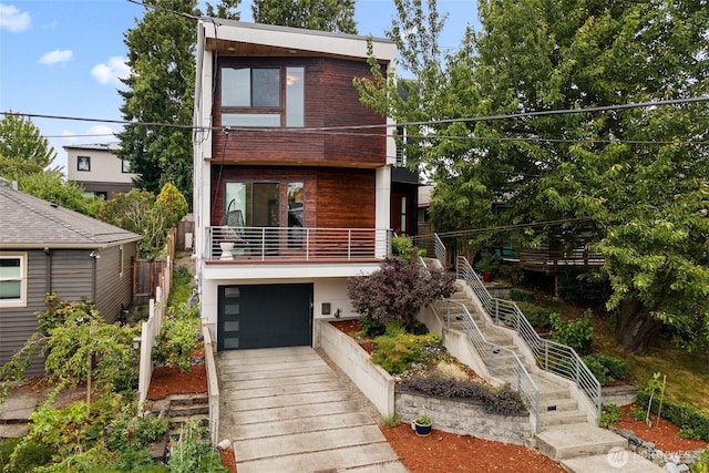4113 Palatine Ave N, Seattle, WA 98103 - contemporary home with stairway, an attached garage, and concrete driveway