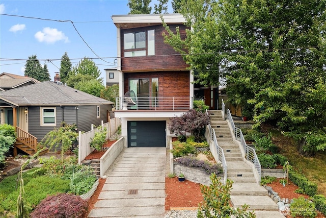 4113 Palatine Ave N, Seattle, WA 98103 - contemporary house featuring stairs, a garage, and concrete driveway