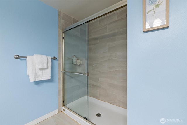 3112 SW Avalon Way Unit 102, Seattle, WA 98126 - full bathroom featuring a stall shower and baseboards