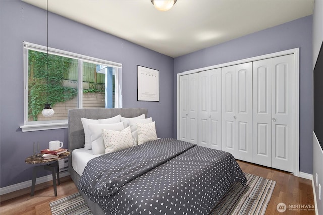 3112 SW Avalon Way Unit 102, Seattle, WA 98126 - bedroom featuring wood finished floors and a closet