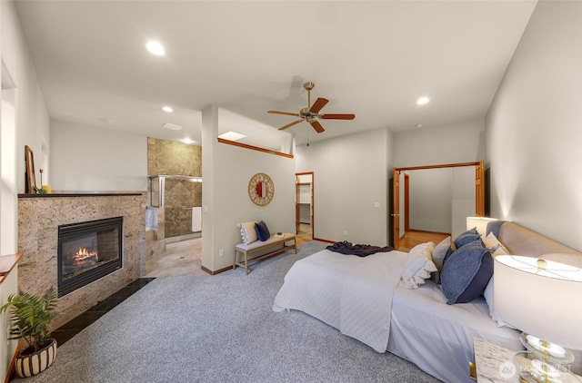 8 Southern Ct, Bellingham, WA 98229 - bedroom featuring recessed lighting, a tile fireplace, connected bathroom, ceiling fan, and carpet flooring