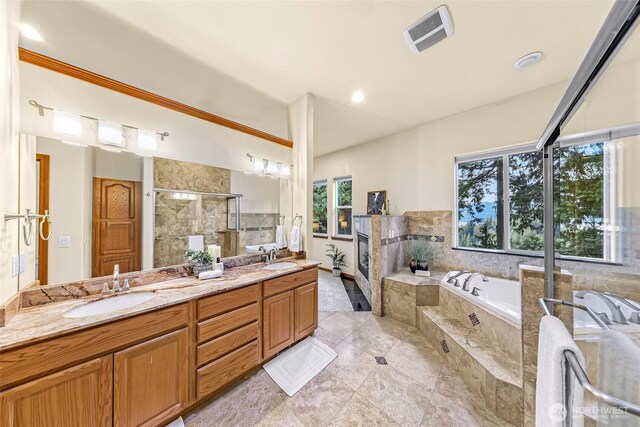 8 Southern Ct, Bellingham, WA 98229 - full bath featuring double vanity, a garden tub, a shower stall, and tile patterned floors