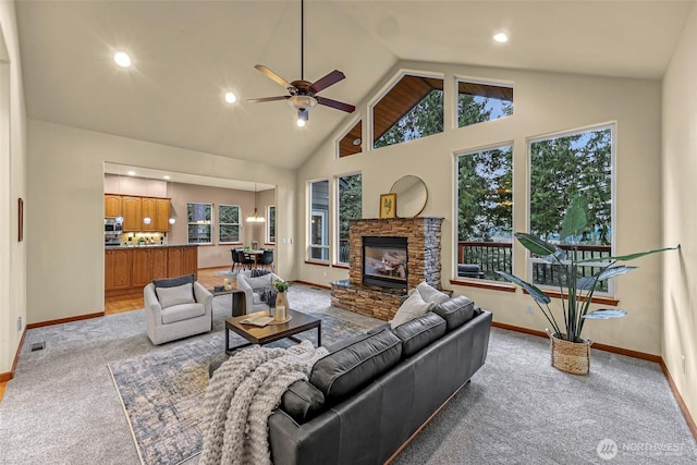 8 Southern Ct, Bellingham, WA 98229 - living room featuring light colored carpet, a ceiling fan, a fireplace, recessed lighting, and high vaulted ceiling