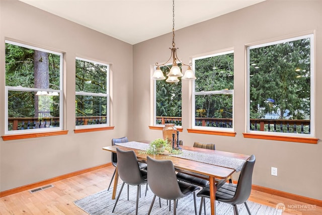 8 Southern Ct, Bellingham, WA 98229 - dining space featuring wood finished floors and a chandelier