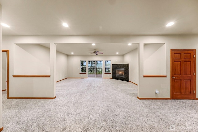 8 Southern Ct, Bellingham, WA 98229 - unfurnished living room with carpet flooring, ceiling fan, a premium fireplace, and recessed lighting